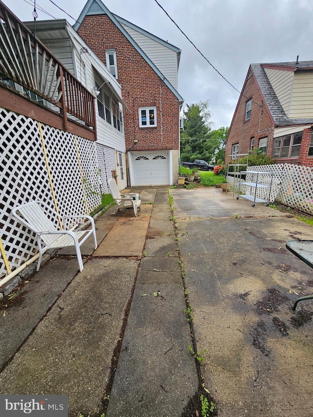 3 W Elm Ave, Baltimore, MD 21206 - view of property exterior featuring asphalt driveway and brick siding