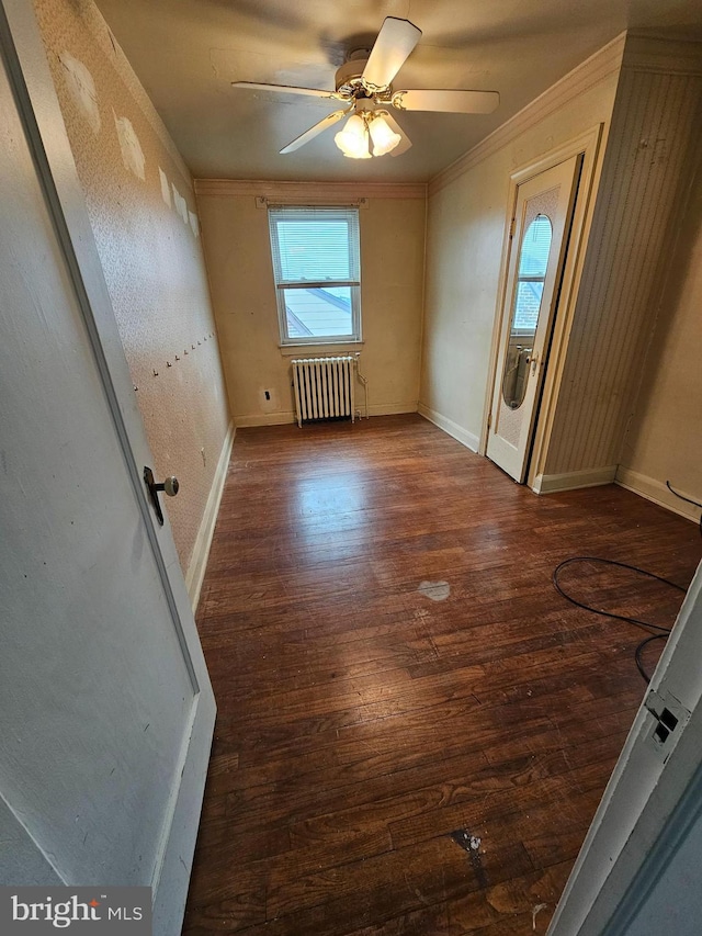3 W Elm Ave, Baltimore, MD 21206 - spare room with radiator, ornamental molding, wood finished floors, ceiling fan, and baseboards