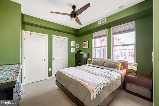 bedroom featuring carpet flooring and a ceiling fan