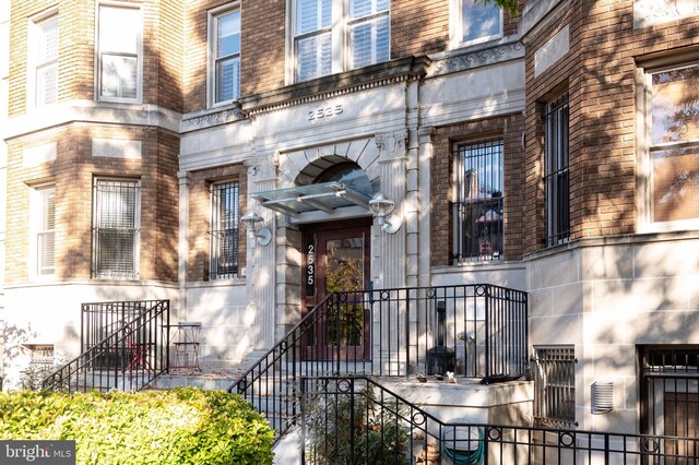 property entrance featuring stone siding