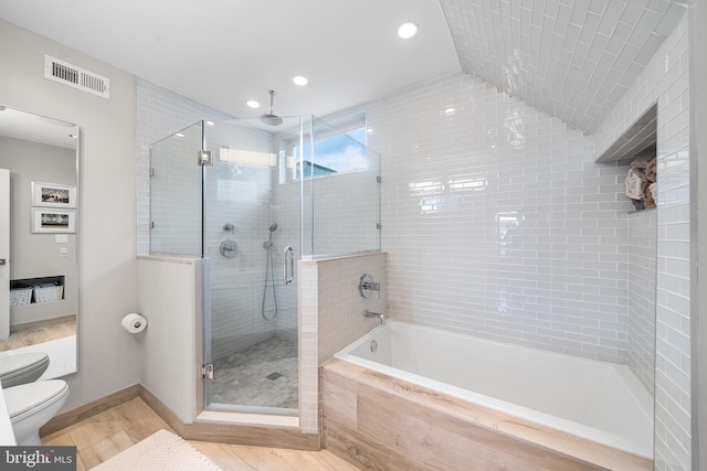 721 S Smedley St, Philadelphia, PA 19146 - bathroom with toilet, a stall shower, a bath, wood finished floors, and recessed lighting