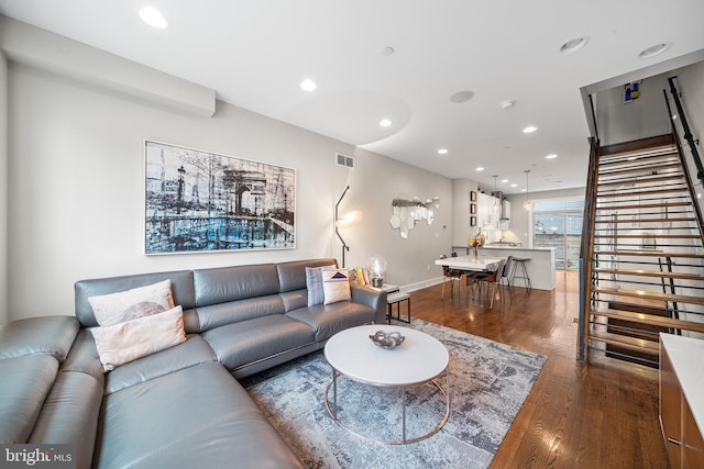 721 S Smedley St, Philadelphia, PA 19146 - living room featuring dark wood-style floors, recessed lighting, stairs, and baseboards