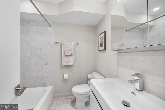 721 S Smedley St, Philadelphia, PA 19146 - bathroom featuring toilet, vanity, tub / shower combination, and baseboards