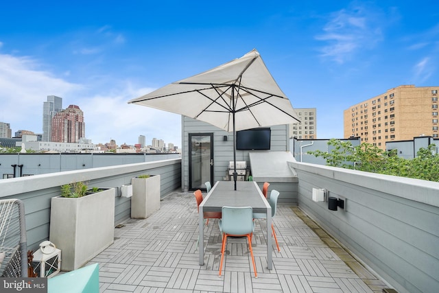 721 S Smedley St, Philadelphia, PA 19146 - view of patio with a city view, a balcony, and outdoor dining space