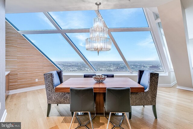 50 S 16th St Unit 5401, Philadelphia, PA 19102 - dining area with a chandelier, wood finished floors, and baseboards