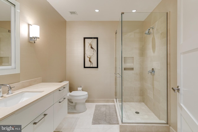 50 S 16th St Unit 5401, Philadelphia, PA 19102 - full bathroom featuring a shower stall, vanity, toilet, tile patterned flooring, and recessed lighting