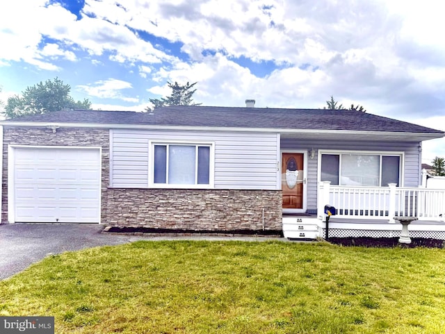 213 Hollywood Ct, Glen Burnie, MD 21060 - single story home with stone siding, an attached garage, a front yard, driveway, and a porch