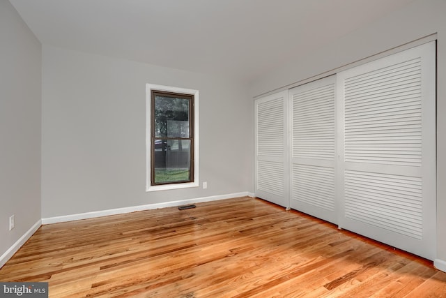 1012 Valewood Rd, Towson, MD 21286 - unfurnished bedroom with light wood finished floors, baseboards, and a closet