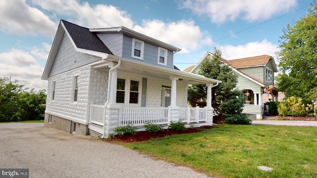 4329 Ridge Rd, Baltimore, MD 21236 - view of front facade with a porch, a front yard, driveway, and a shingled roof
