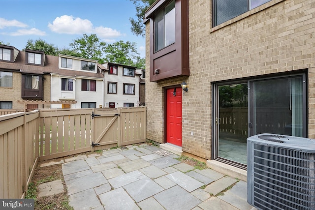 9928 Brookridge Ct, Gaithersburg, MD 20886 - view of patio / terrace featuring central AC unit and a gate