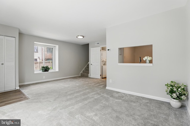 9928 Brookridge Ct, Gaithersburg, MD 20886 - unfurnished living room featuring carpet flooring, stairway, and baseboards