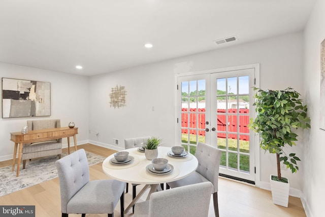 2532 Sedgewick Pl, Dumfries, VA 22026 - dining area featuring french doors, light wood-style flooring, healthy amount of natural light, recessed lighting, and baseboards