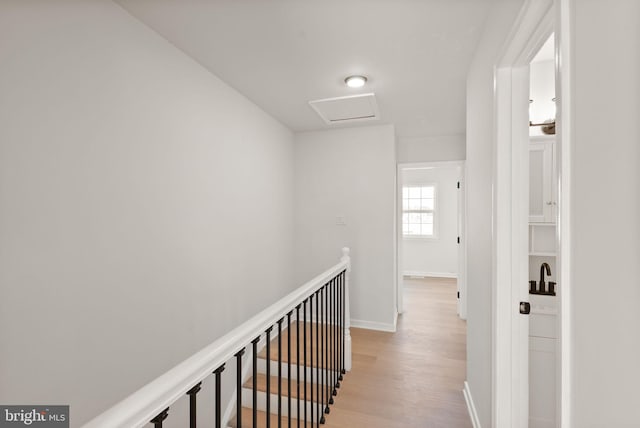 2532 Sedgewick Pl, Dumfries, VA 22026 - corridor featuring attic access, light wood-style flooring, baseboards, and an upstairs landing