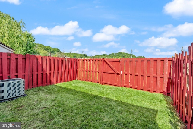view of yard with central AC
