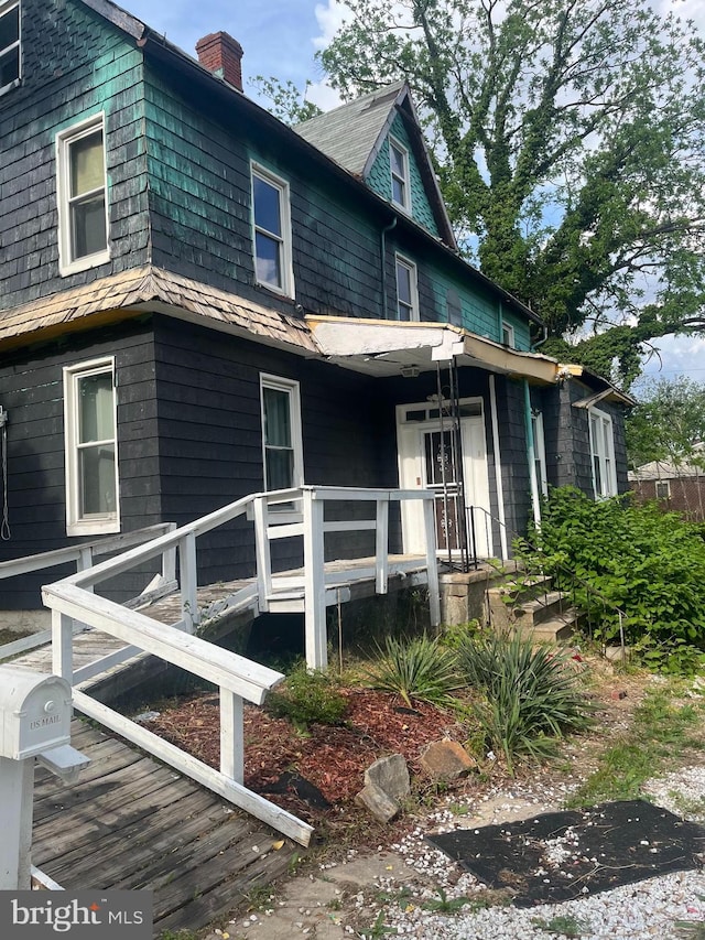 435 S Augusta Ave, Baltimore, MD 21229 - view of front facade featuring a chimney