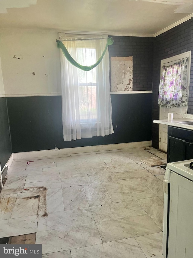435 S Augusta Ave, Baltimore, MD 21229 - interior space featuring crown molding, white range with electric cooktop, and baseboards