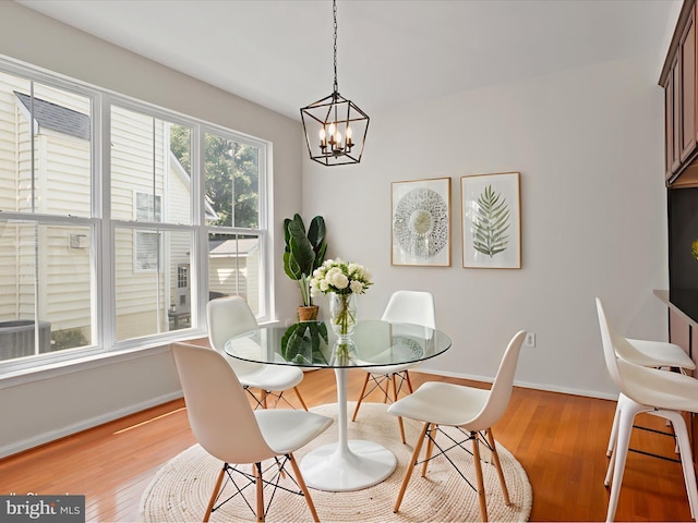 17494 Lethridge Cir, Round Hill, VA 20141 - dining space with a chandelier and light wood-style floors