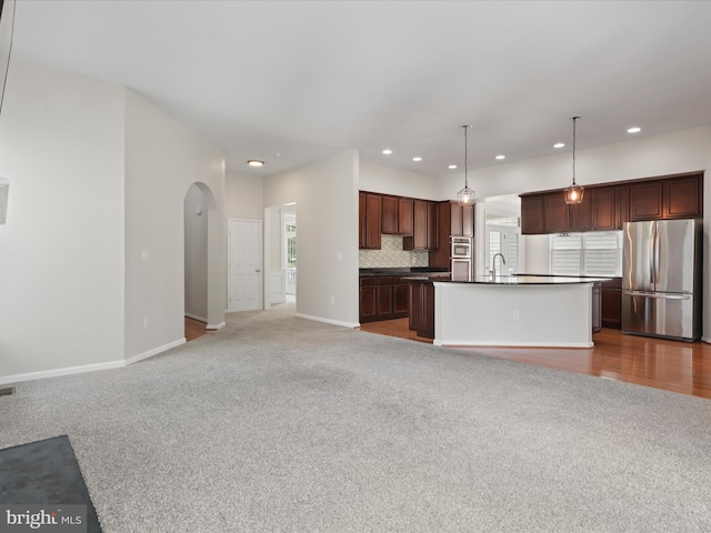 17494 Lethridge Cir, Round Hill, VA 20141 - unfurnished living room with carpet flooring, arched walkways, and recessed lighting