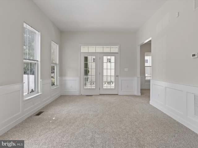 17494 Lethridge Cir, Round Hill, VA 20141 - spare room with carpet flooring, a wainscoted wall, and a decorative wall