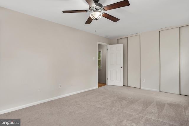 103 Barnsfield Ct Unit 227, Gaithersburg, MD 20878 - unfurnished bedroom with multiple closets, light colored carpet, baseboards, and ceiling fan