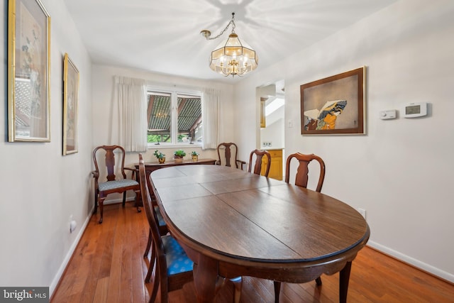 2 Tomahawk Dr, Marlton, NJ 08053 - dining room with a chandelier, baseboards, and wood finished floors