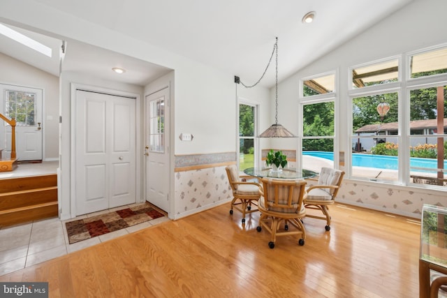 2 Tomahawk Dr, Marlton, NJ 08053 - dining room with lofted ceiling, light wood-type flooring, a skylight, and baseboards