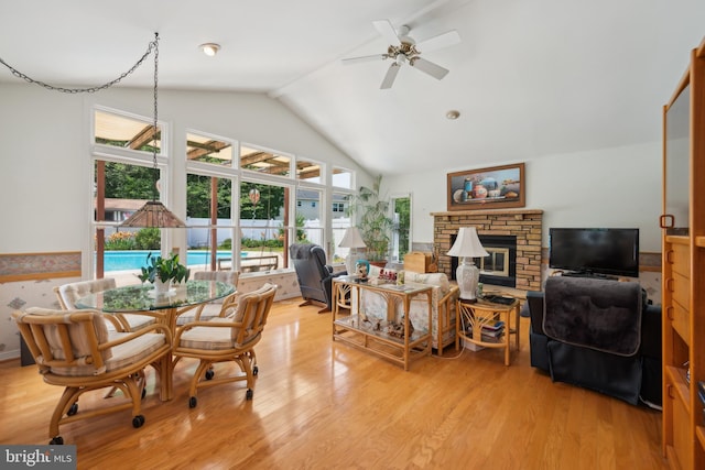2 Tomahawk Dr, Marlton, NJ 08053 - dining space with a fireplace, ceiling fan, light wood-style flooring, and high vaulted ceiling