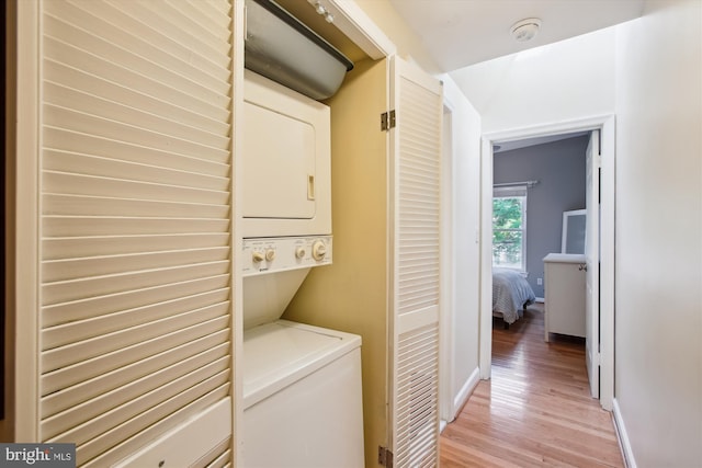 1725 Willard St NW Unit 3, Washington, DC 20009 - laundry area featuring stacked washing machine and dryer and light wood finished floors
