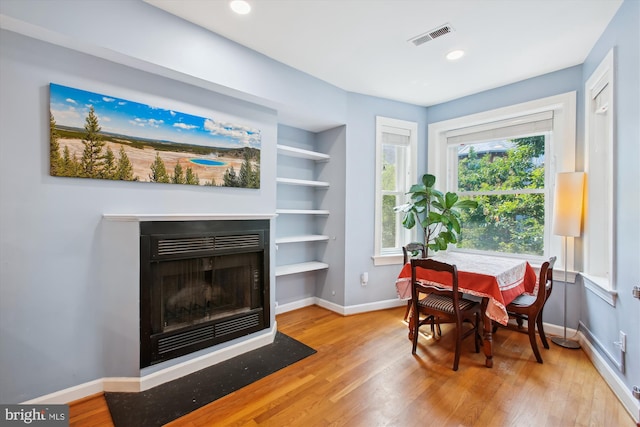 1725 Willard St NW Unit 3, Washington, DC 20009 - office with wood finished floors, a fireplace with flush hearth, and built in shelves