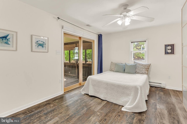735 Shore Dr, Edgewater, MD 21037 - bedroom featuring access to exterior, wood finished floors, multiple windows, and a baseboard heating unit