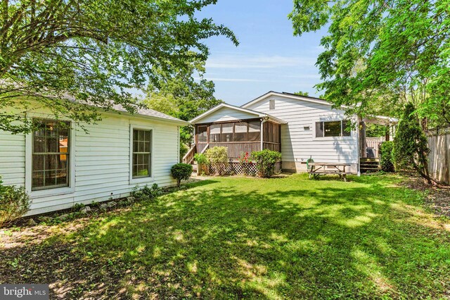735 Shore Dr, Edgewater, MD 21037 - rear view of house with a sunroom