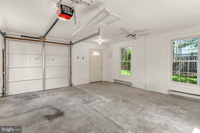 735 Shore Dr, Edgewater, MD 21037 - garage featuring a baseboard heating unit, a garage door opener, and a baseboard radiator
