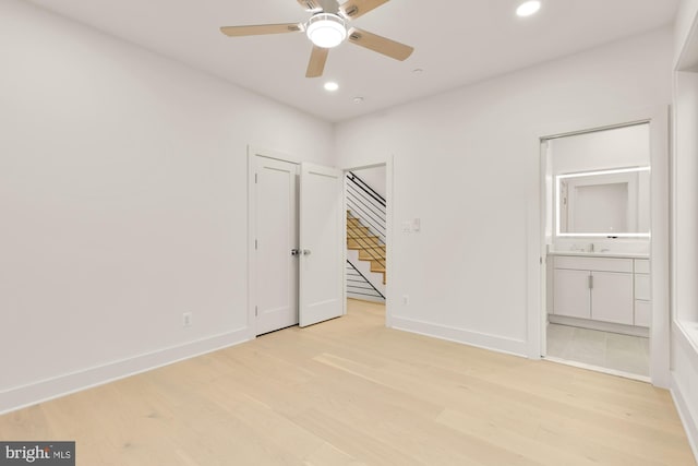 503 L St NE Unit B, Washington, DC 20002 - unfurnished bedroom with light wood-style flooring, recessed lighting, ensuite bath, and baseboards
