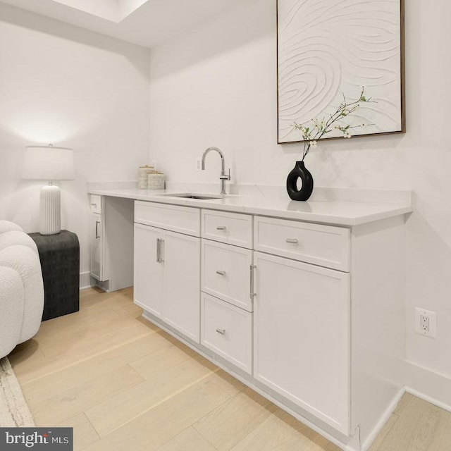 503 L St NE Unit B, Washington, DC 20002 - bar area featuring a sink and light wood finished floors