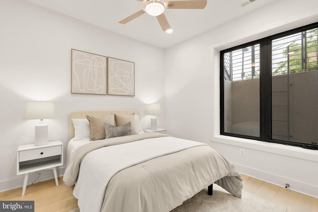 503 L St NE Unit B, Washington, DC 20002 - bedroom with light wood-style floors, a ceiling fan, and baseboards