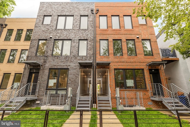 503 L St NE Unit B, Washington, DC 20002 - view of front of property featuring brick siding and a fenced front yard