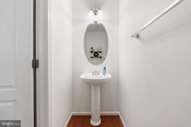 42030 Zircon Dr, Aldie, VA 20105 - bathroom featuring baseboards, wood finished floors, and a sink