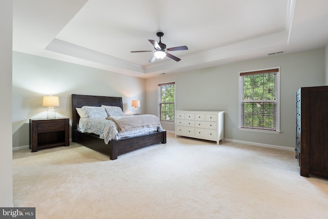 42030 Zircon Dr, Aldie, VA 20105 - carpeted bedroom featuring a tray ceiling, baseboards, ceiling fan, and ornamental molding