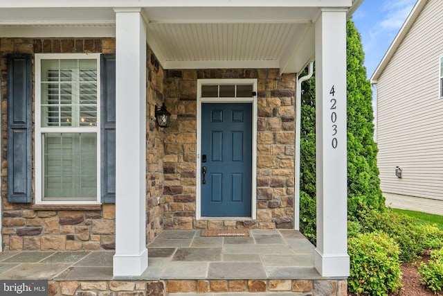 42030 Zircon Dr, Aldie, VA 20105 - doorway to property featuring stone siding and a porch