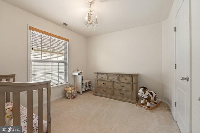 42030 Zircon Dr, Aldie, VA 20105 - bedroom with light carpet, a chandelier, baseboards, and a nursery area