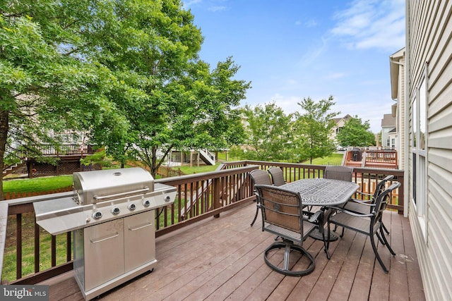 42030 Zircon Dr, Aldie, VA 20105 - wooden deck with outdoor dining area and grilling area