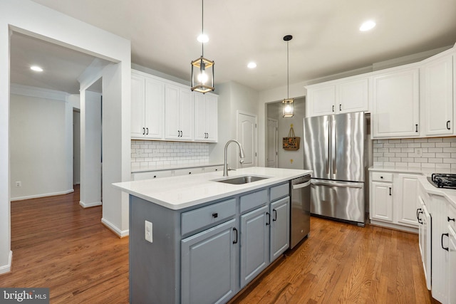 42030 Zircon Dr, Aldie, VA 20105 - kitchen with appliances with stainless steel finishes, gray cabinetry, a sink, white cabinetry, and recessed lighting
