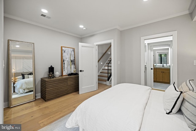 1407 1st St NW Unit 1, Washington, DC 20001 - bedroom featuring light wood-type flooring, ornamental molding, recessed lighting, connected bathroom, and baseboards