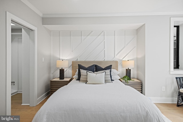 1407 1st St NW Unit 1, Washington, DC 20001 - bedroom featuring baseboards, crown molding, and wood finished floors