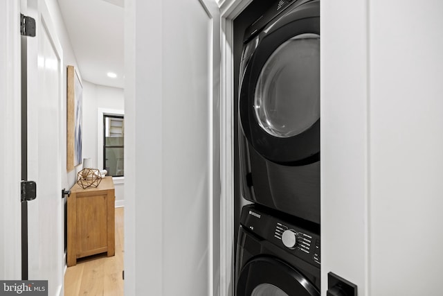 1407 1st St NW Unit 1, Washington, DC 20001 - washroom featuring stacked washer / drying machine, light wood-type flooring, and recessed lighting