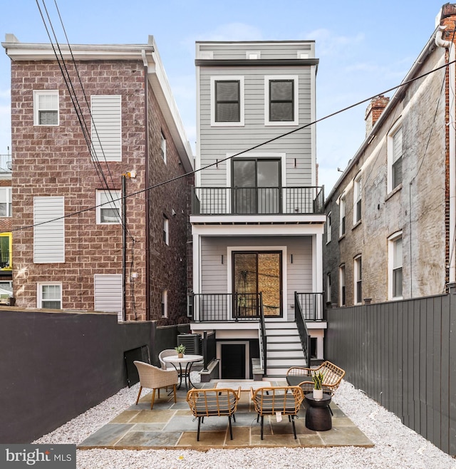1407 1st St NW Unit 1, Washington, DC 20001 - back of property with stairs, fence, a patio area, and a balcony