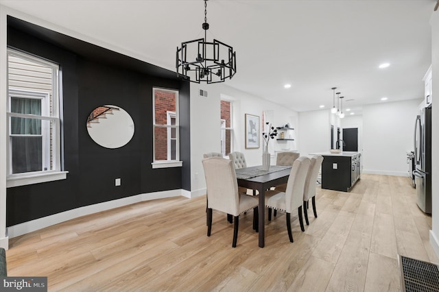 642 S 51st St, Philadelphia, PA 19143 - dining room featuring a chandelier, light wood-style floors, recessed lighting, and baseboards