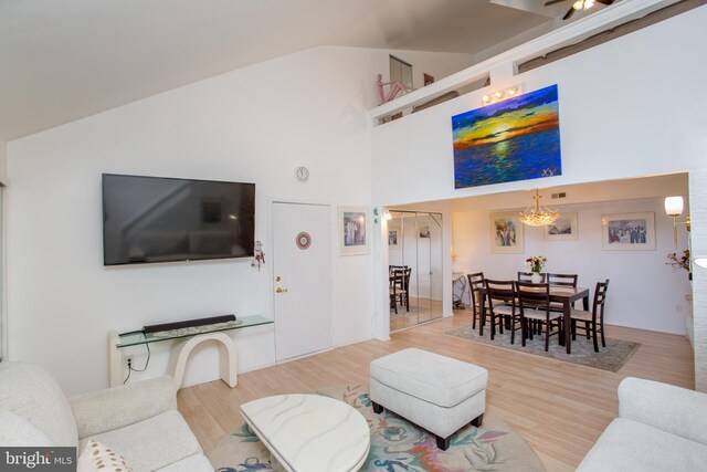 48 Bonnie Gellman Ct Unit B48, Philadelphia, PA 19114 - living area featuring wood finished floors, a chandelier, and high vaulted ceiling