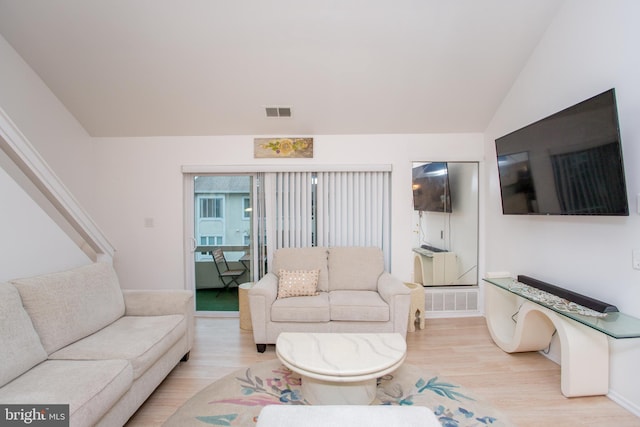 48 Bonnie Gellman Ct Unit B48, Philadelphia, PA 19114 - living room featuring light wood-style floors, lofted ceiling, and baseboards