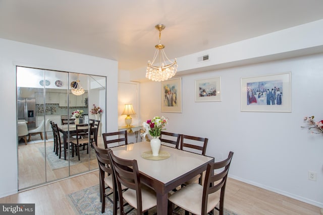 48 Bonnie Gellman Ct Unit B48, Philadelphia, PA 19114 - dining room featuring a chandelier and light wood finished floors